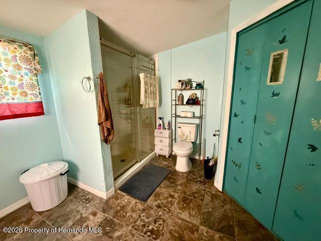11340 Southwest 28th Way Webster, FL 33597 - Photo 21 of 38 This is an elongated high toilet and a built in shower.