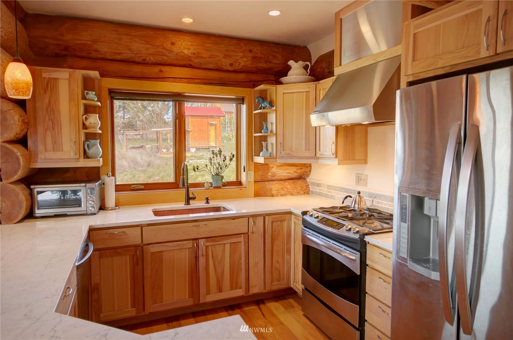 20 Pony Road Winthrop, WA 98862 - Photo 13 of 40 a kitchen with stainless steel appliances granite countertop a sink a stove and a refrigerator