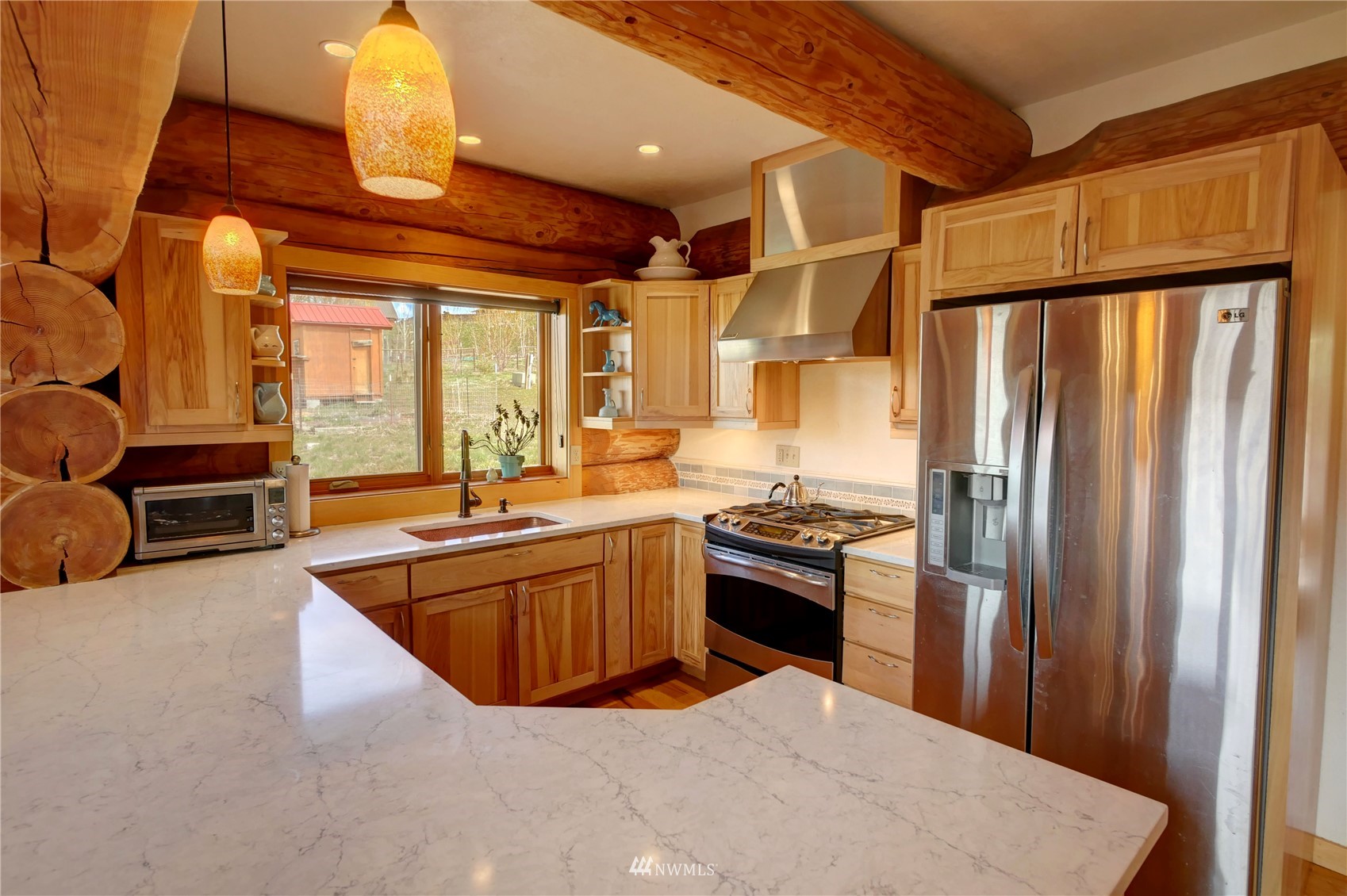 20 Pony Road Winthrop, WA 98862 - Photo 14 of 40 a kitchen with stainless steel appliances granite countertop a refrigerator a stove and a sink