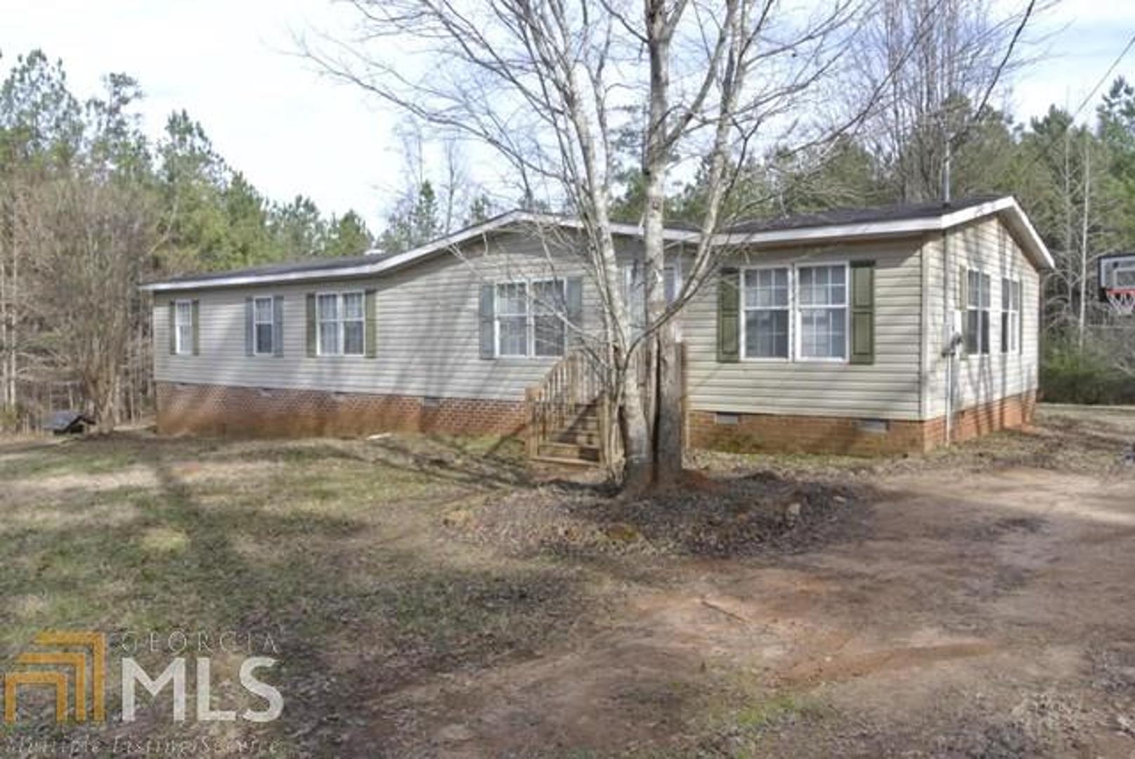 520 Hamlin Road Jackson, GA 30233 - Photo 1 of 1 a view of a house with a yard