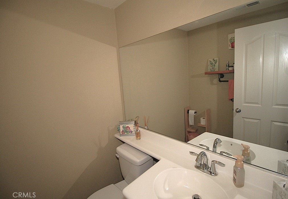 924 Condor Street Barstow, CA 92311 - Photo 14 of 52 a bathroom with a sink and toilet