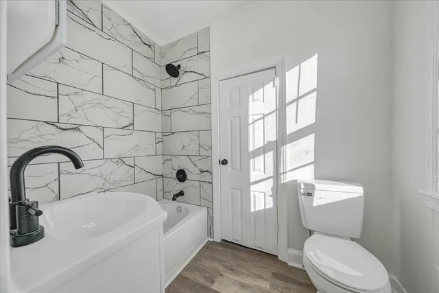 a bathroom with a sink and toilet