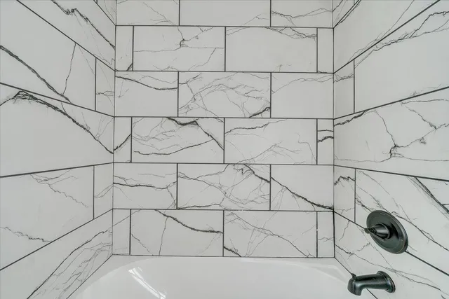 a view of a balcony with wooden floor