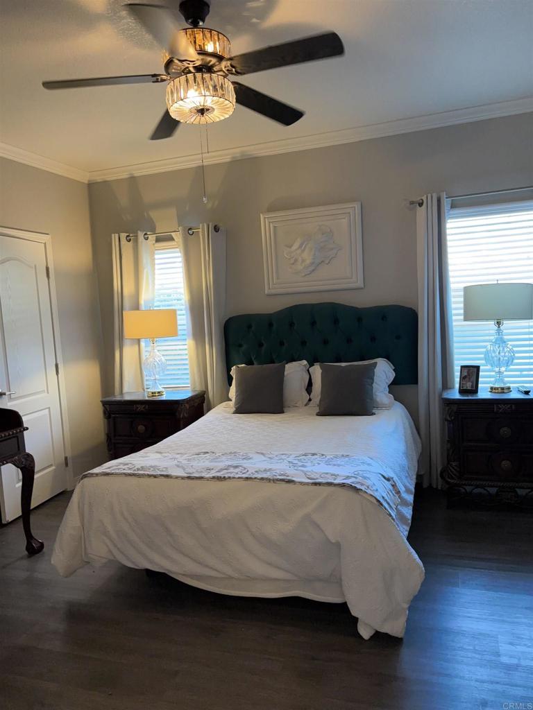 4650 Dulin Road, Unit 192 Fallbrook, CA 92003 - Photo 23 of 42 a bedroom with a bed and wooden floor