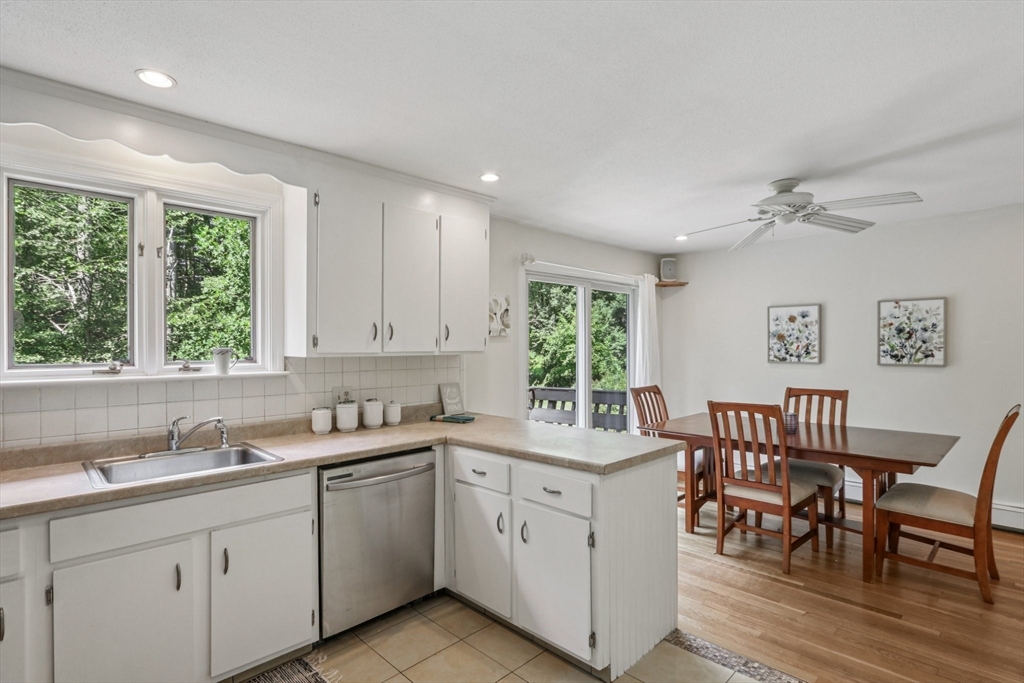 318 Harvard Road Stow, MA 01775 - Photo 8 of 40 a kitchen with a sink window and chairs