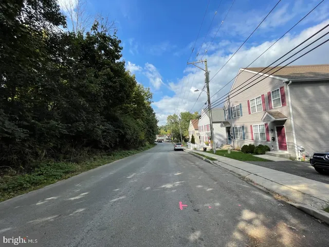 a view of a street with a building in the background