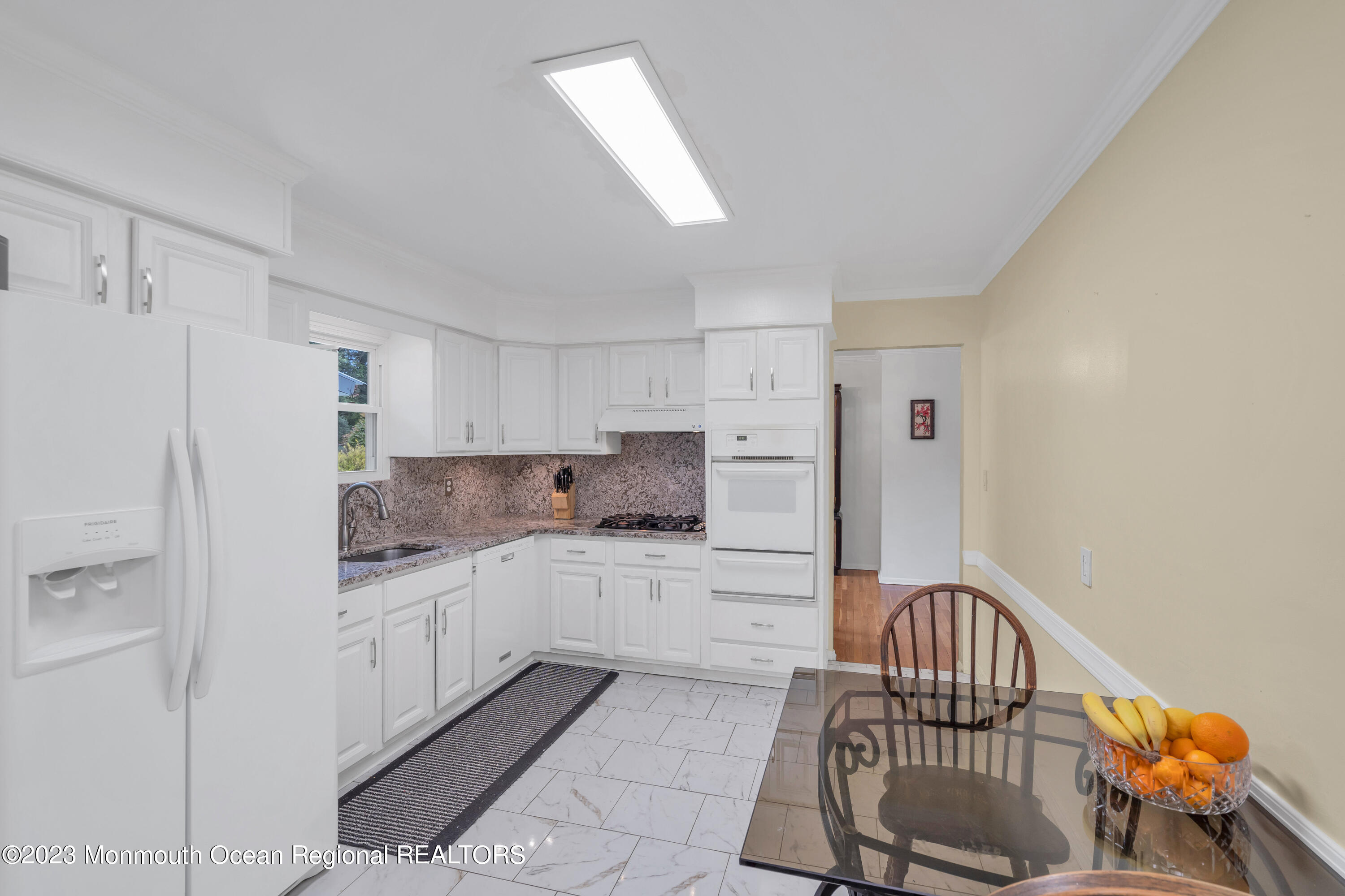36 Westbrook Road Howell, NJ 07731 - Photo 17 of 49 a kitchen with stainless steel appliances kitchen island granite countertop a refrigerator and a stove top oven
