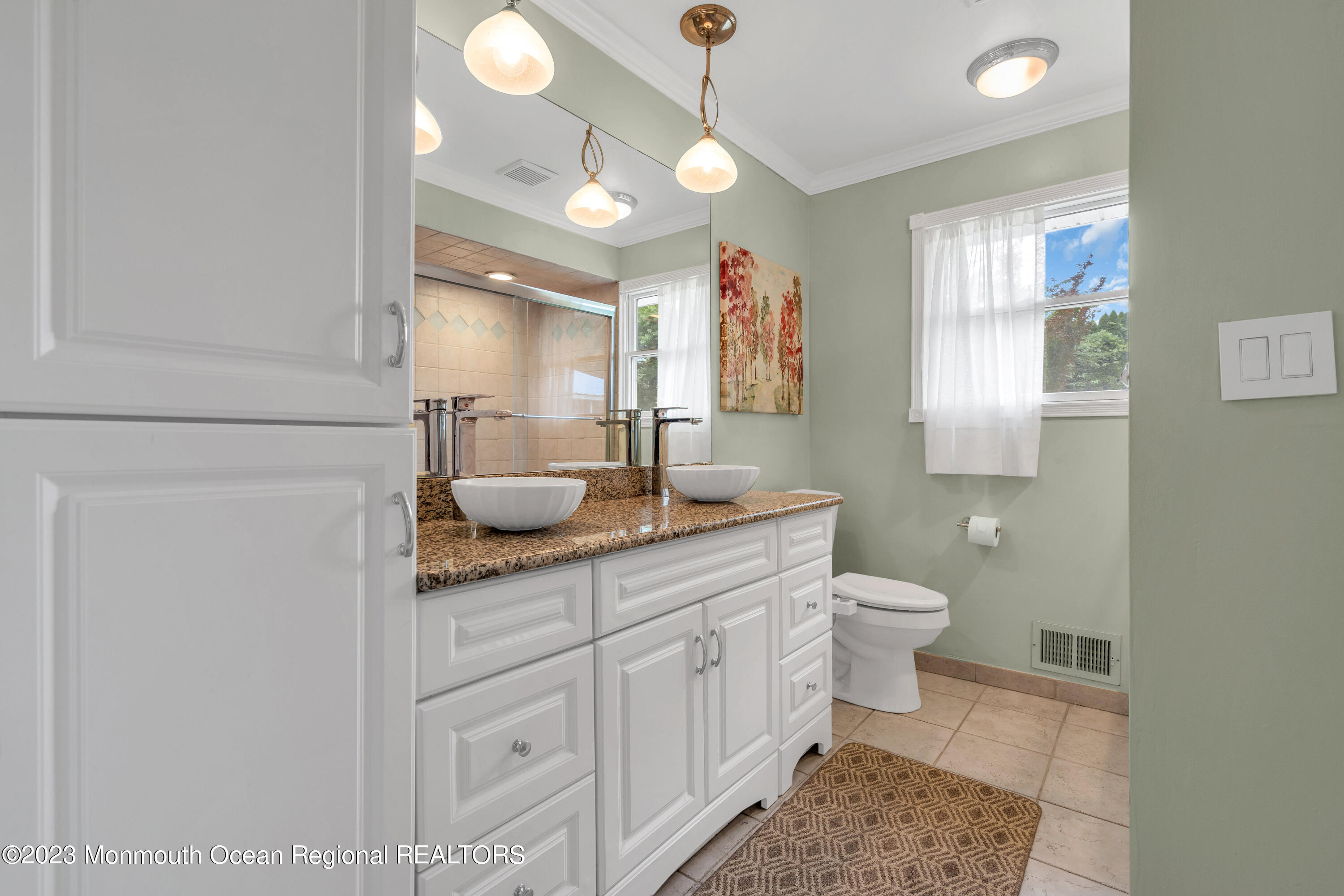 36 Westbrook Road Howell, NJ 07731 - Photo 25 of 49 a bathroom with a granite countertop sink a toilet and a mirror