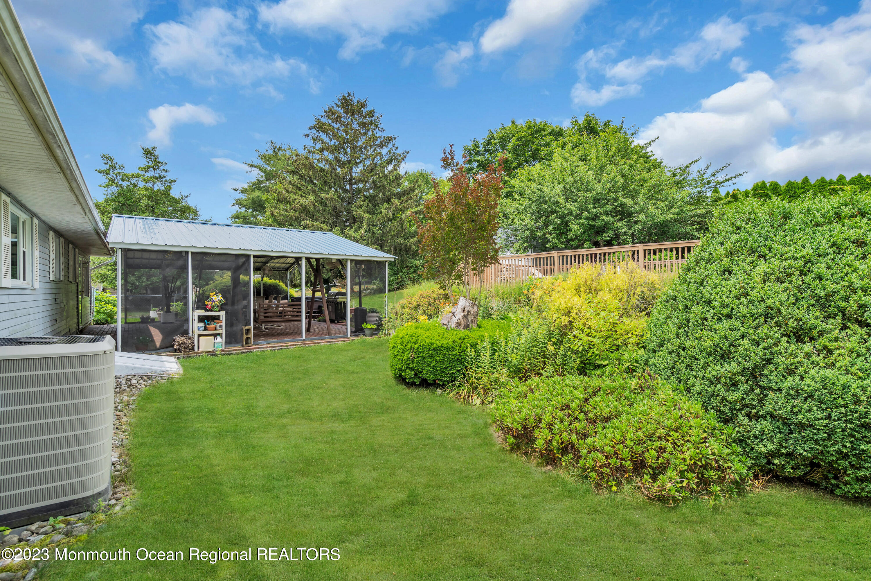 36 Westbrook Road Howell, NJ 07731 - Photo 39 of 49 a view of a house with backyard sitting area and garden