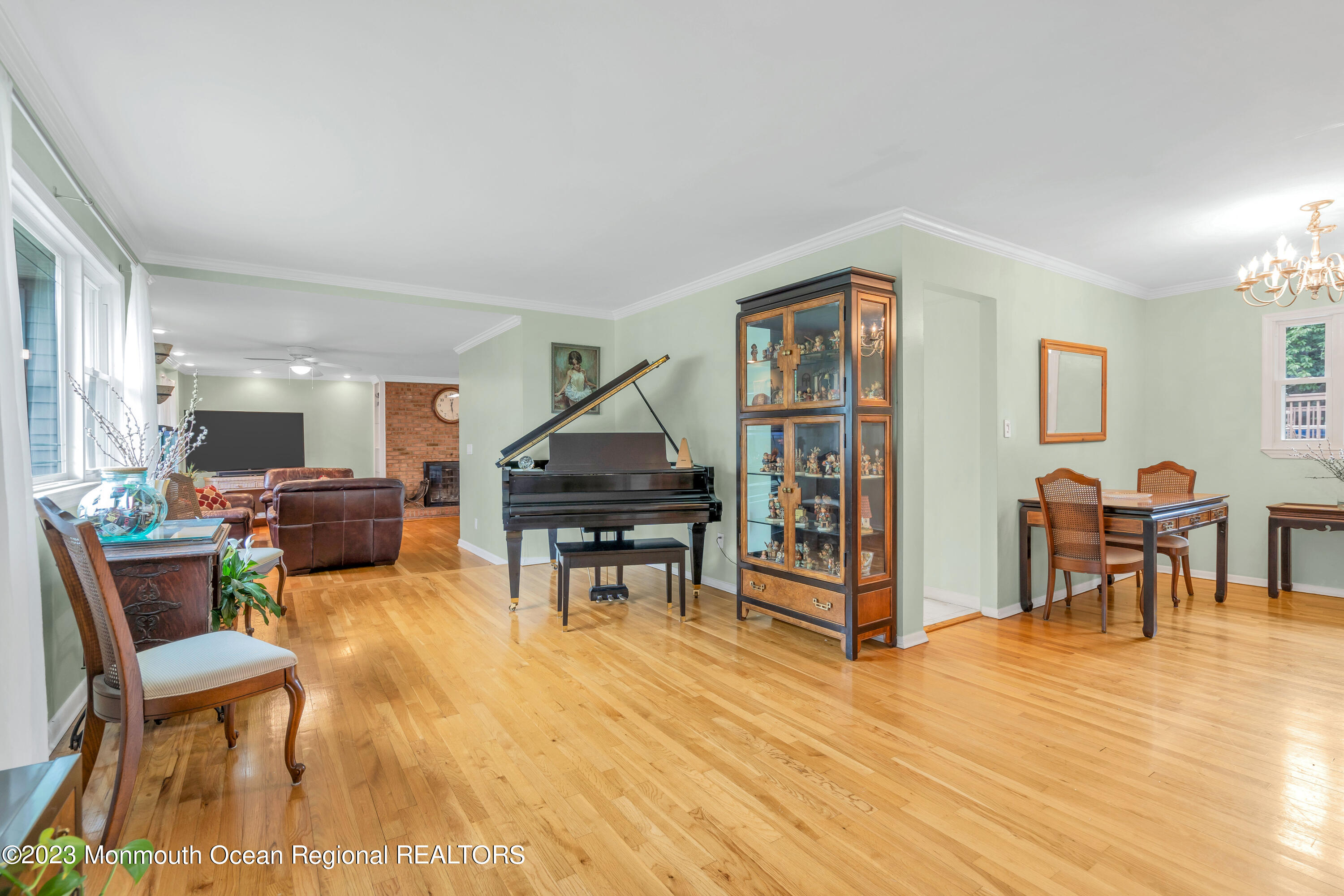36 Westbrook Road Howell, NJ 07731 - Photo 5 of 49 a living room with furniture a dining table and a wooden floor