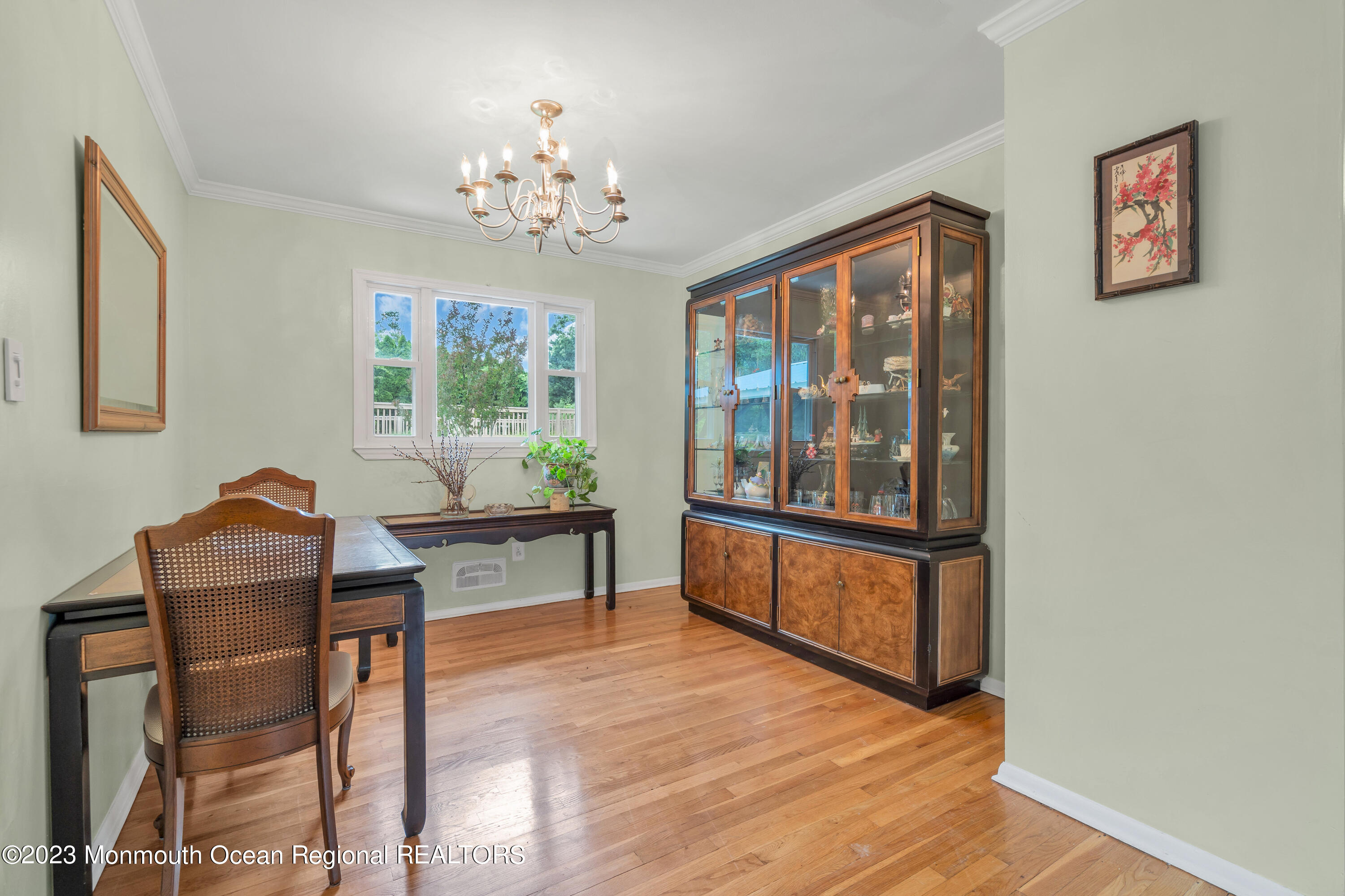 36 Westbrook Road Howell, NJ 07731 - Photo 7 of 49 a living room with furniture a chandelier and a window