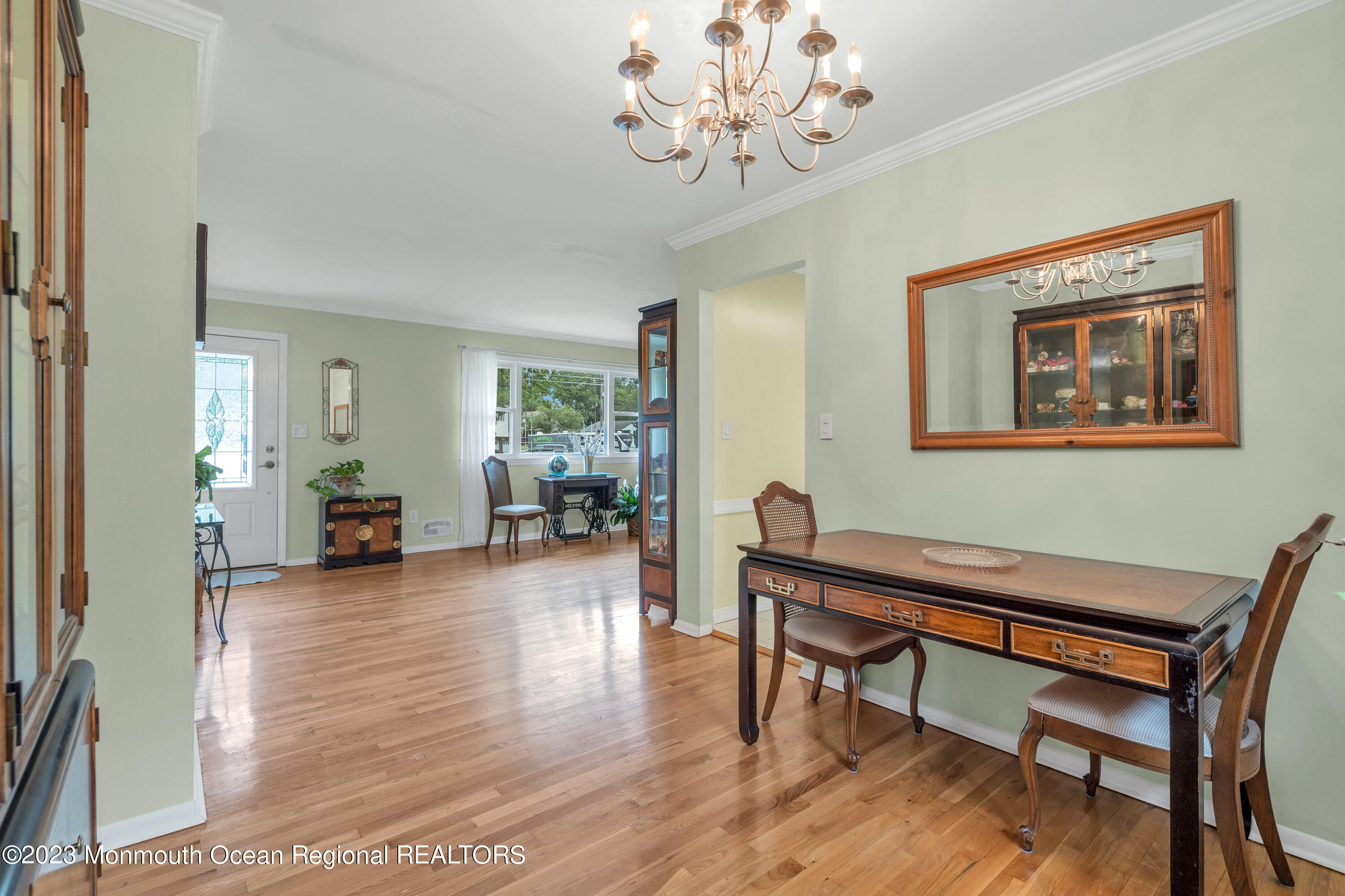36 Westbrook Road Howell, NJ 07731 - Photo 8 of 49 a view of a livingroom with furniture a chandelier and wooden floor