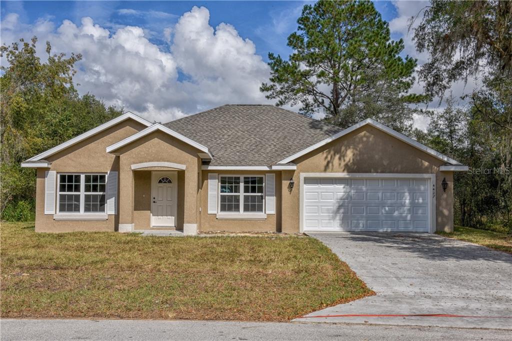 4778 166th Loop Ocala, FL 34473 - Photo 1 of 1 front view of house with a yard