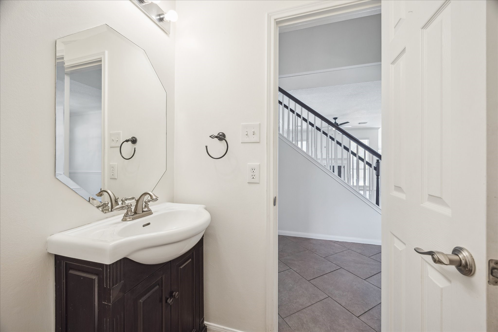 12831 Dove Point Lane Houston, TX 77041 - Photo 31 of 50 a bathroom with a sink a mirror and a shower