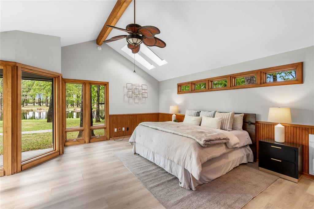 692 Private Road 5937 Emory, TX 75440 - Photo 24 of 40 a spacious bedroom with a bed and a large window