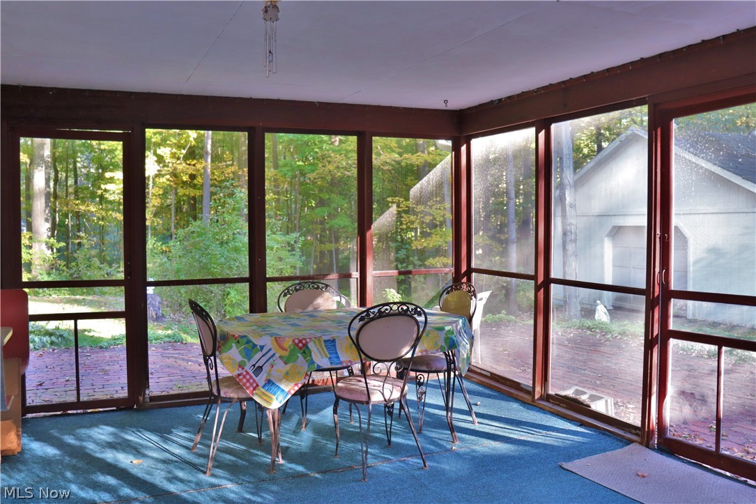 8407 Cedar Road Chesterland, OH 44026 - Photo 15 of 33 Screened in porch off the lower living room with view of the large outbuilding