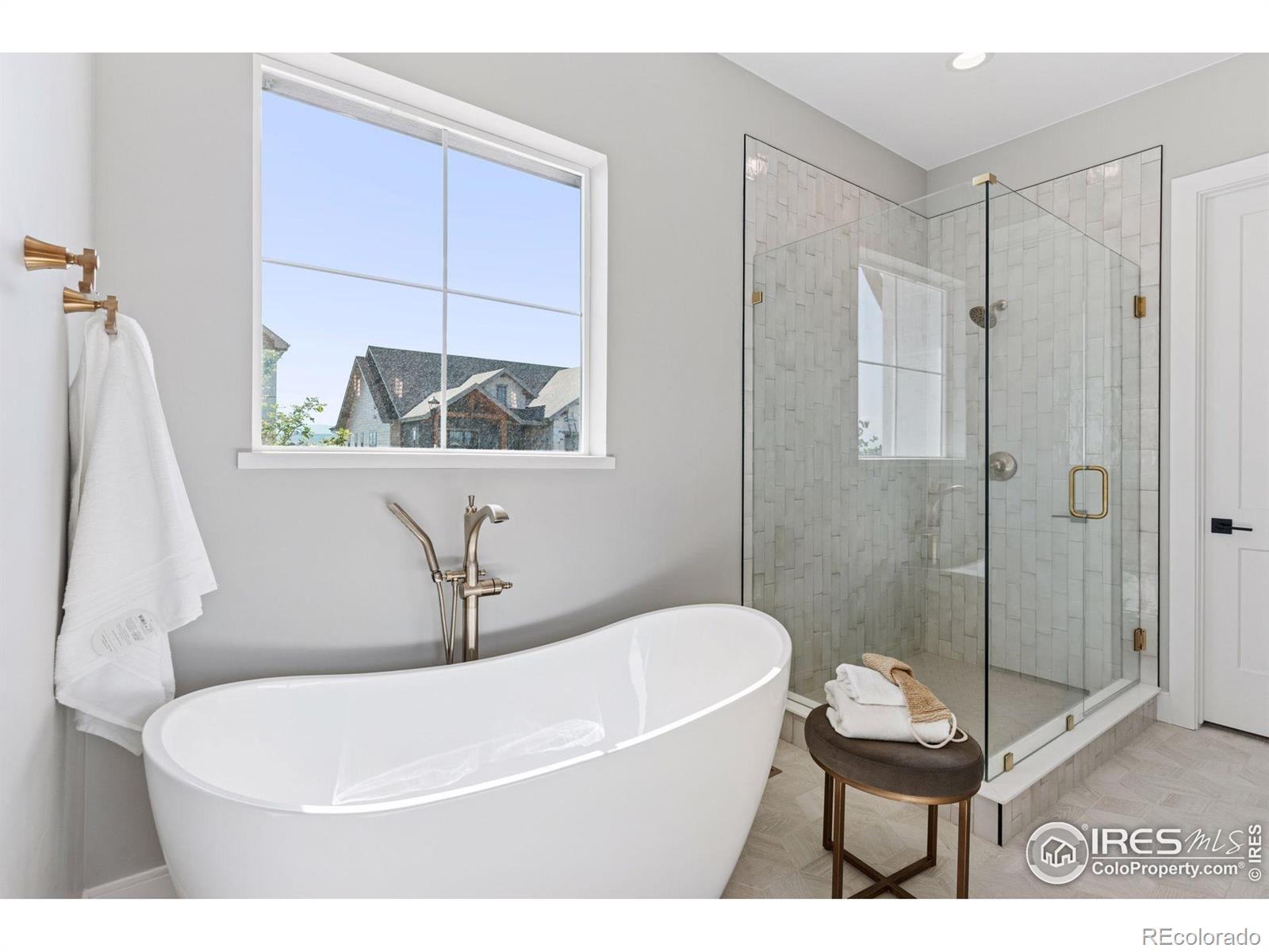 953 William Way Berthoud, CO 80513 - Photo 15 of 20 a white bath tub sitting next to a white toilet