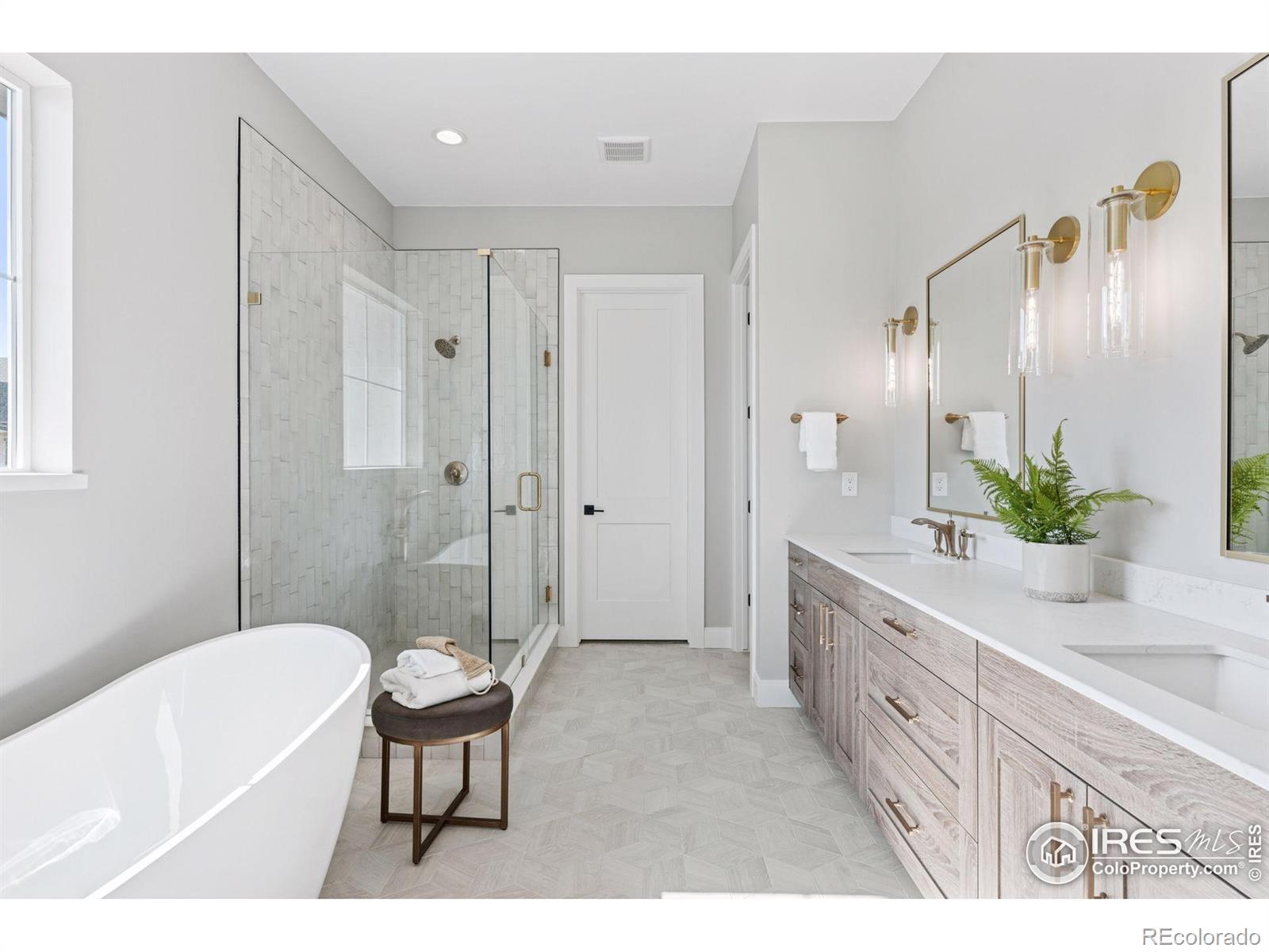 953 William Way Berthoud, CO 80513 - Photo 16 of 20 a spacious bathroom with a granite countertop tub sink and mirror