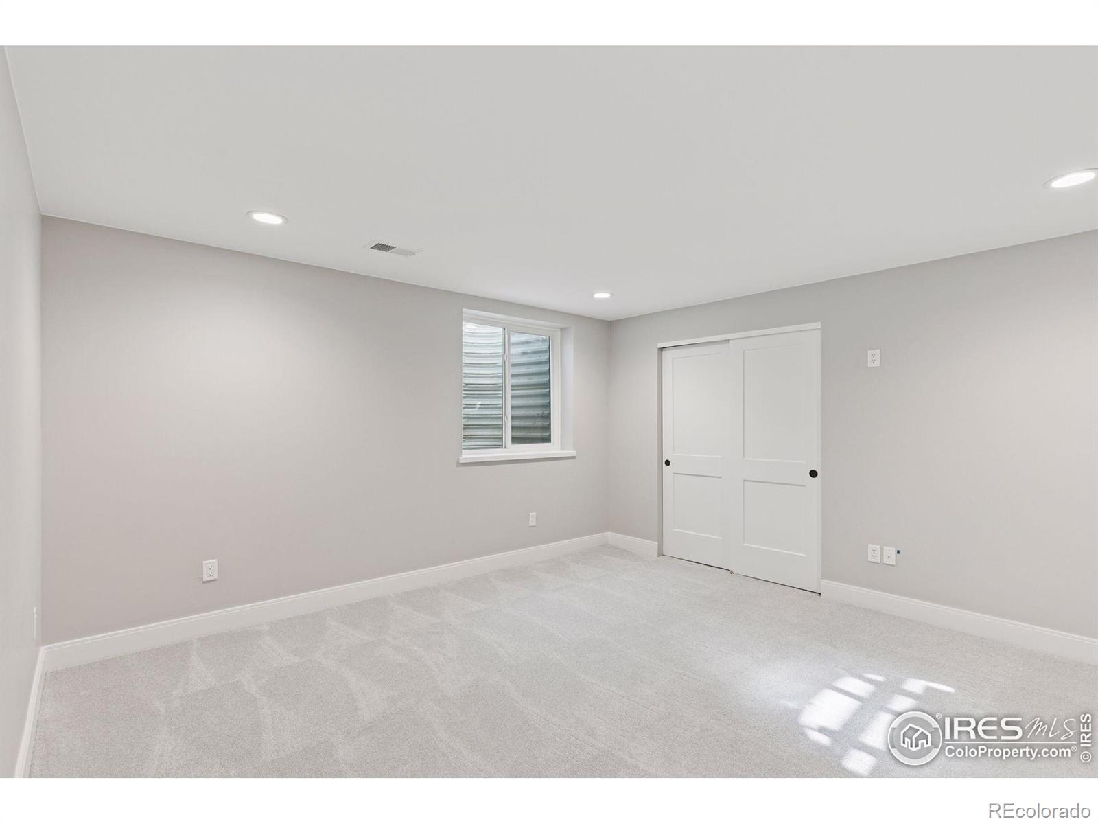 953 William Way Berthoud, CO 80513 - Photo 20 of 20 a view of an empty room with a window