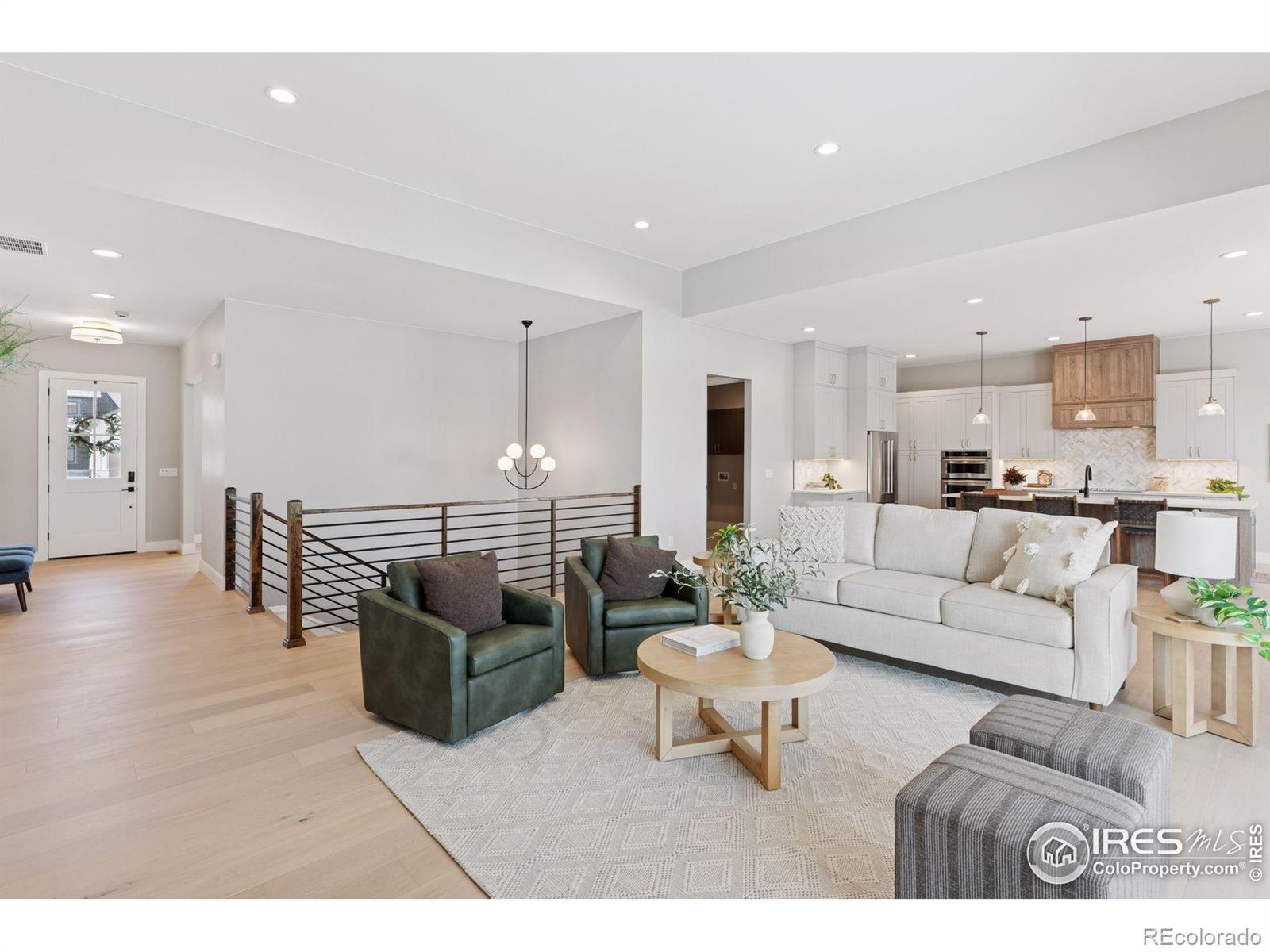 953 William Way Berthoud, CO 80513 - Photo 4 of 20 a living room with furniture and view of kitchen