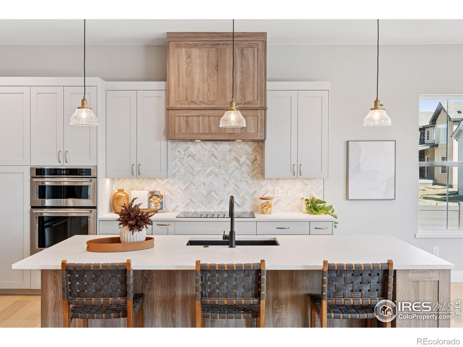 953 William Way Berthoud, CO 80513 - Photo 5 of 20 a kitchen with cabinets a sink and appliances
