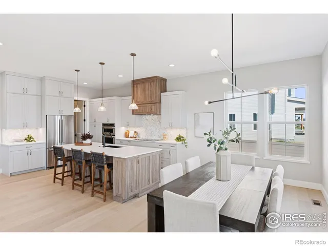 a very nice looking dining room with a table and chairs