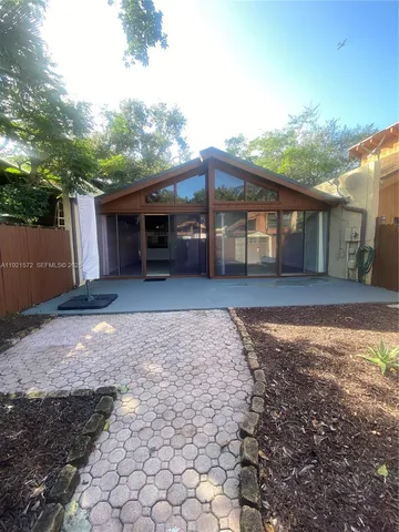 a house view with a backyard space