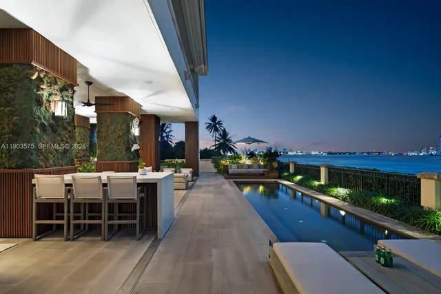 a view of a swimming pool with a patio