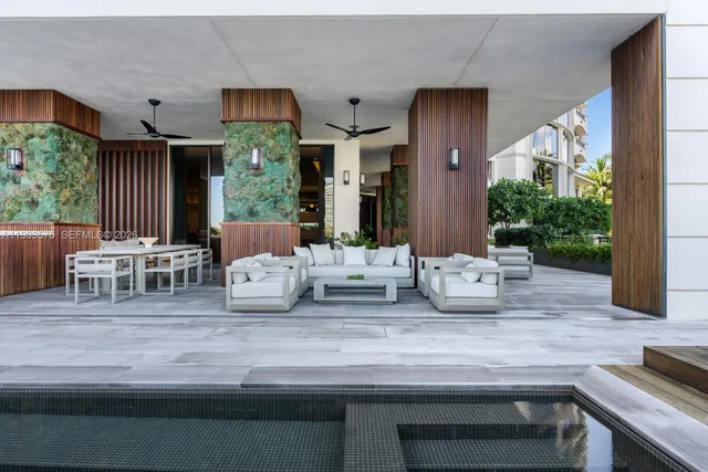 a view of kitchen with furniture and large windows