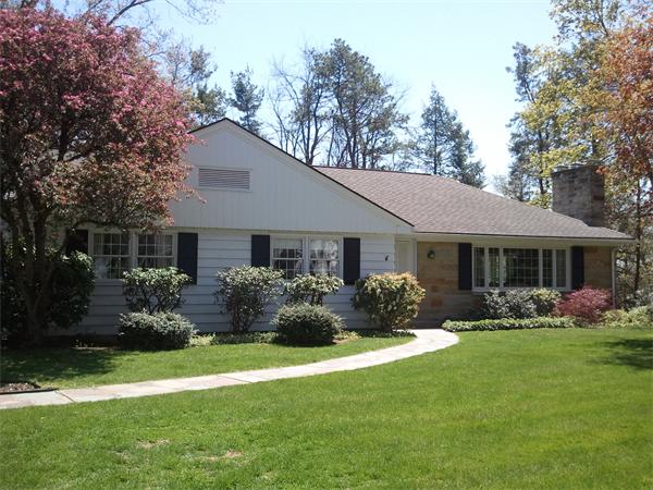 9 Ridgeway Circle Springfield, MA 01118 - Photo 1 of 13 a front view of a house with garden and porch