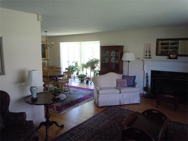 9 Ridgeway Circle Springfield, MA 01118 - Photo 7 of 13 a living room with furniture a fireplace and a flat screen tv