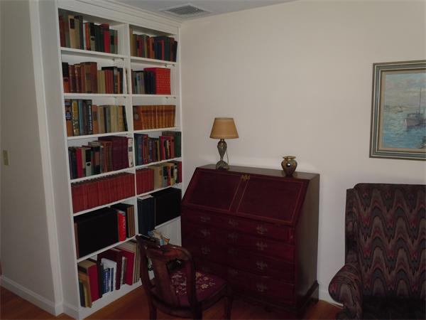 9 Ridgeway Circle Springfield, MA 01118 - Photo 8 of 13 a living room with a bookshelf and a large window