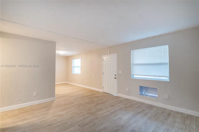 a view of an empty room and window