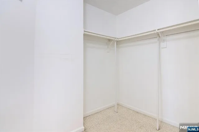 a close view of a utility room with dryer and washer