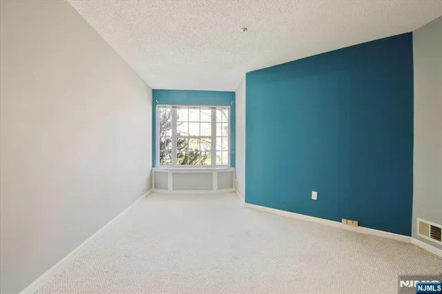 a bathroom with a sink toilet vanity and shower