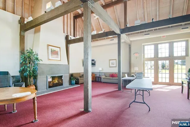 a front view of a house with large windows