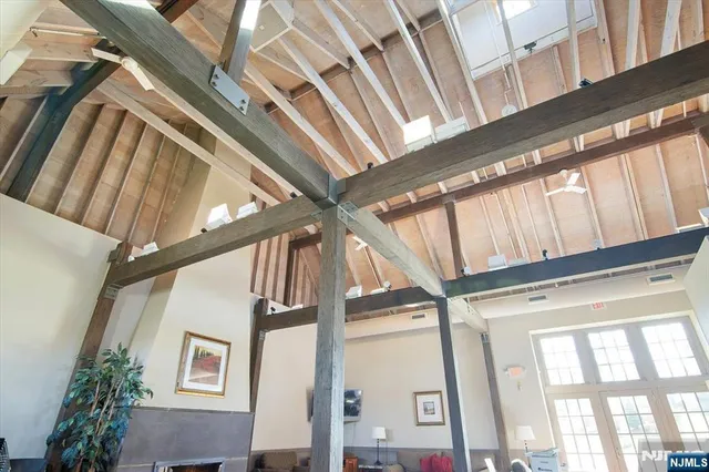 a view of a yard with plants and trees