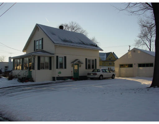 20 Rochester Street Chicopee, MA 01020 - Photo 1 of 1 a front view of a house with a yard