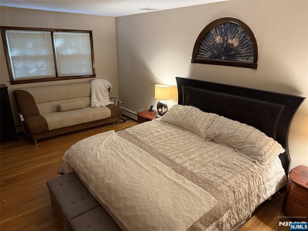 36 Lavina Trail Oak Ridge, NJ 07438 - Photo 20 of 26 a bedroom with a bed and a painting on the wall