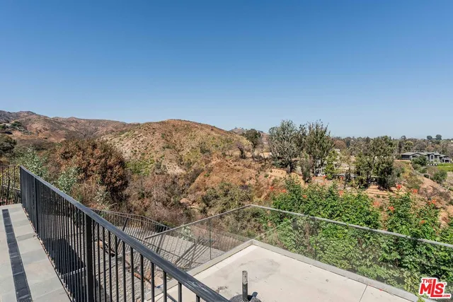 a view of a mountain from a balcony