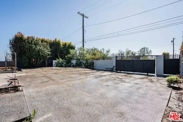a backyard of a house with a tree
