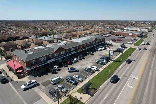 an aerial view of a city with parking