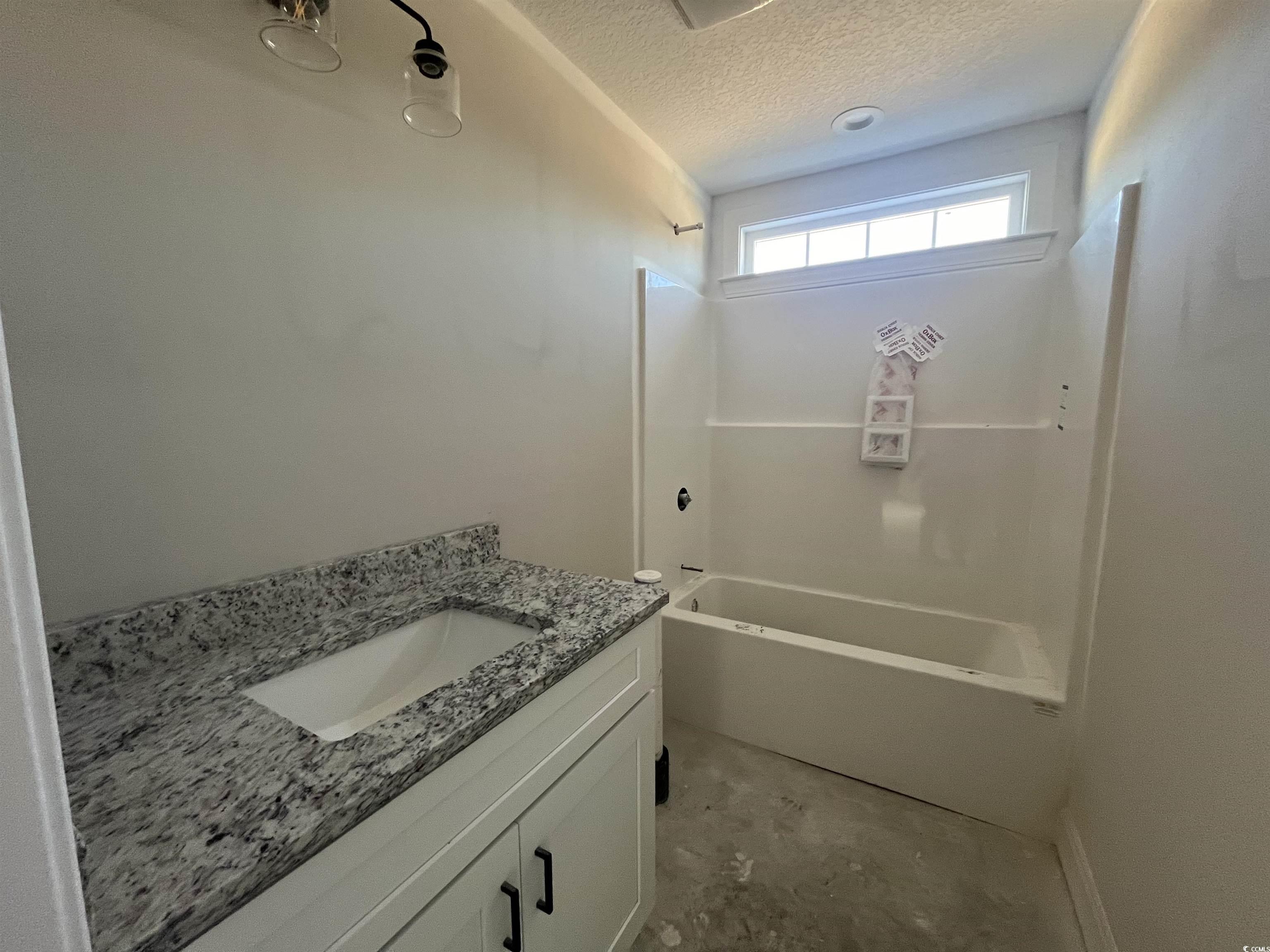 479 Highway 348 Loris, SC 29569 - Photo 13 of 13 Bathroom featuring vanity, shower / tub combinatio