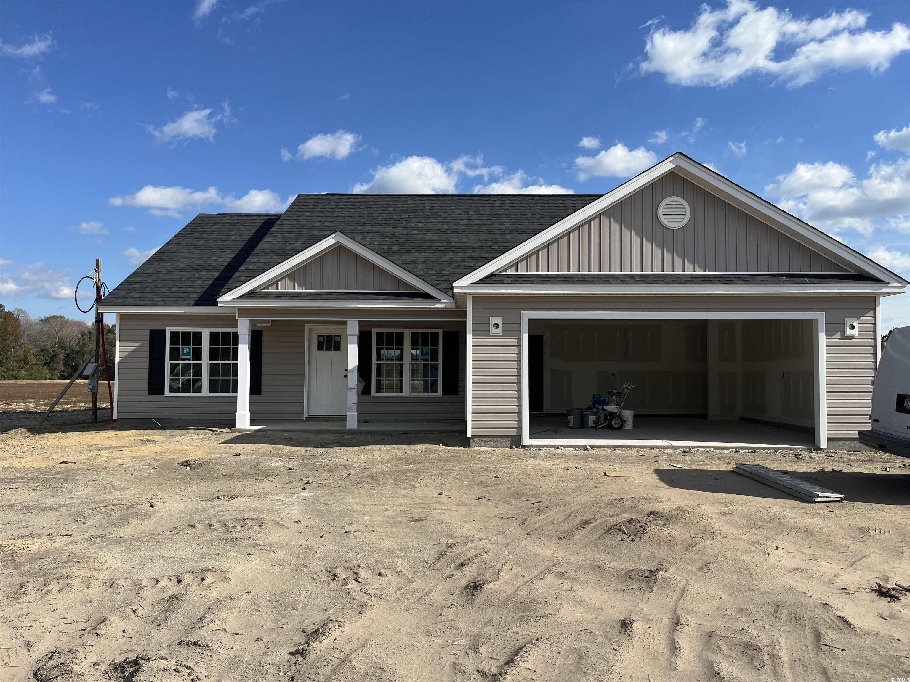 479 Highway 348 Loris, SC 29569 - Photo 3 of 13 View of front of property with a porch and a garag