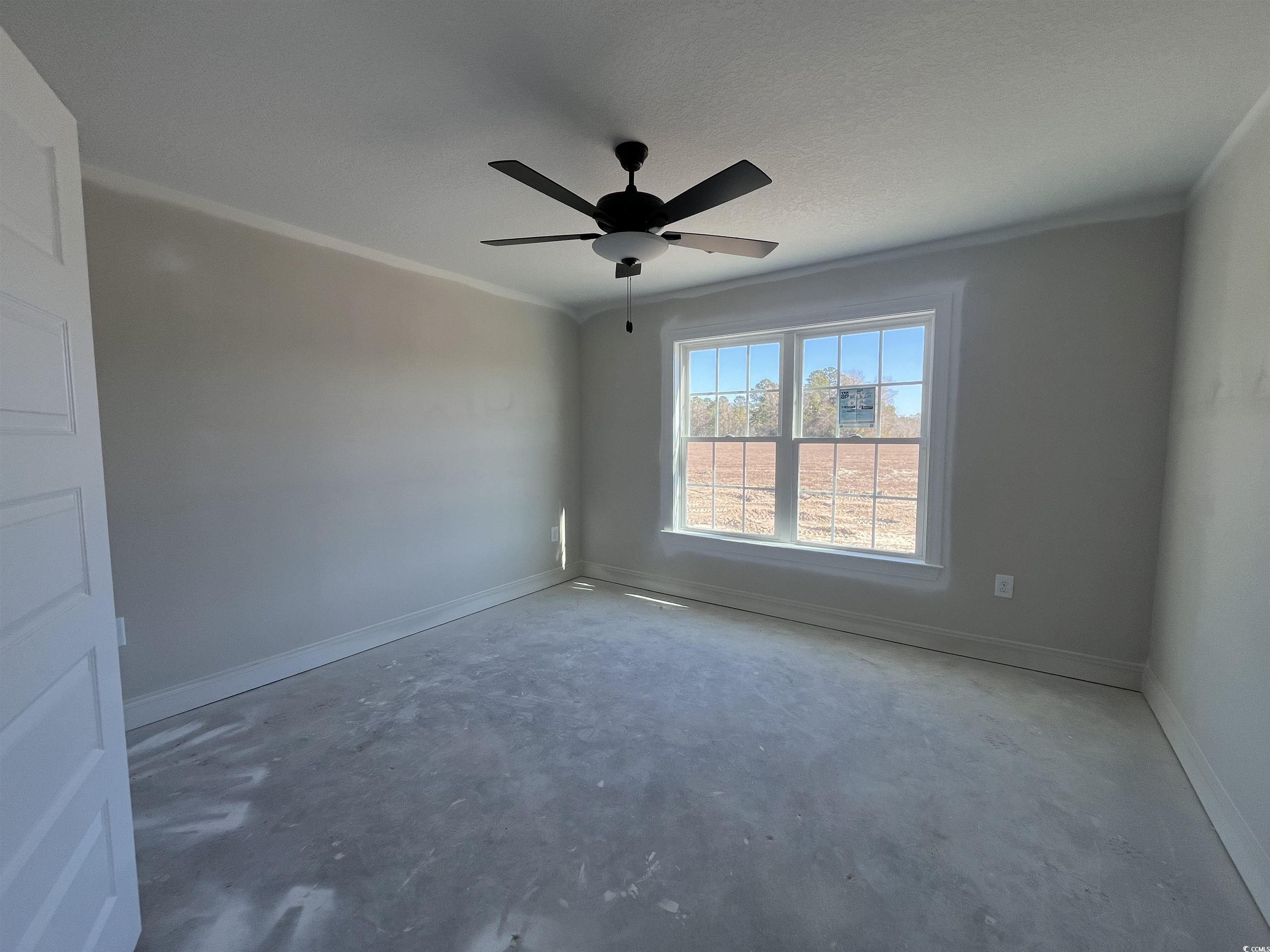 479 Highway 348 Loris, SC 29569 - Photo 10 of 13 Empty room with a textured ceiling, ornamental mol
