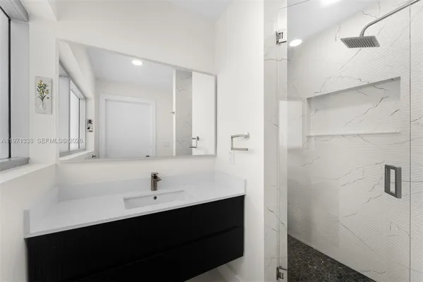a bathroom with a sink and a mirror
