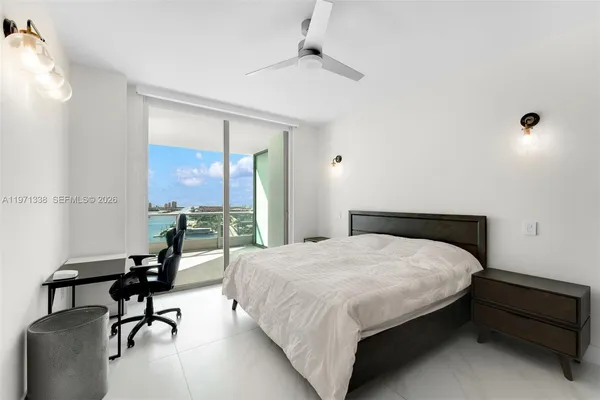 a bedroom with a bed and a table