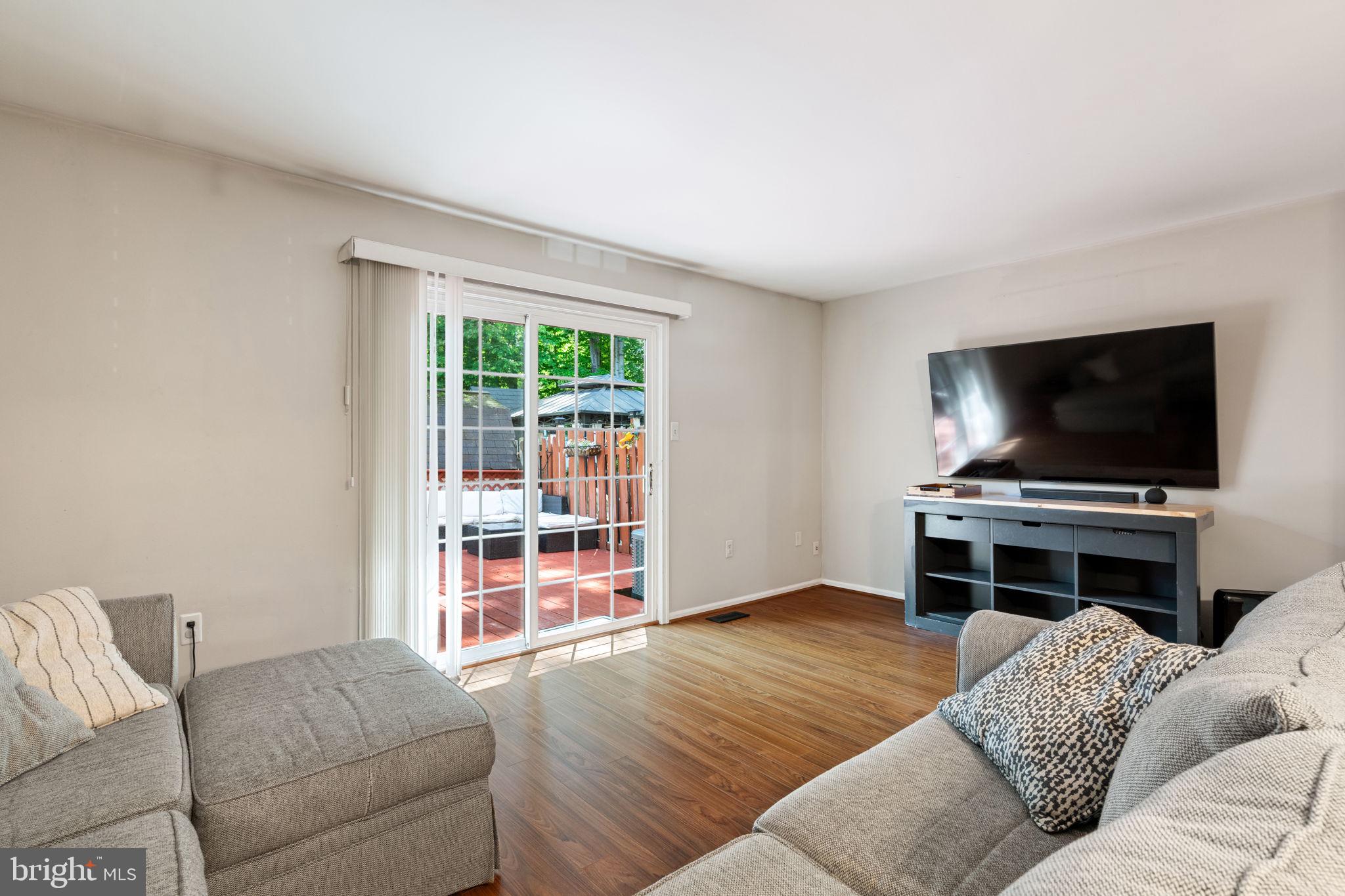 7932 Pebble Brook Court Springfield, VA 22153 - Photo 7 of 33 Light bright living room with walkout to deck