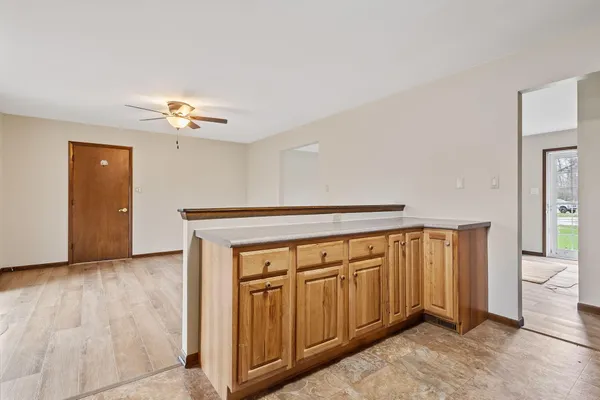 a view of an entryway with wooden floor