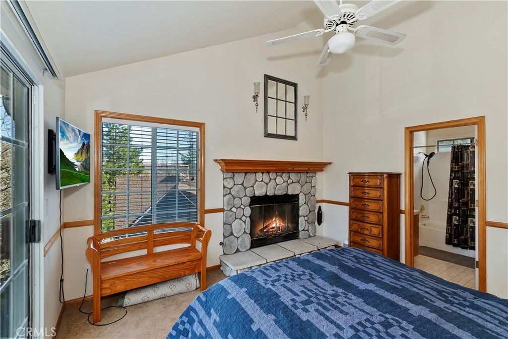 28223 North Bay Road Lake Arrowhead, CA 92352 - Photo 17 of 39 a living room with furniture and a fireplace